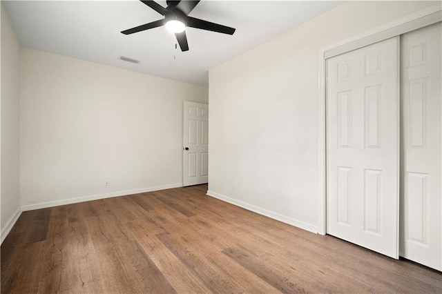 3001 Demetropolis Rd, Mobile, AL 36693 - unfurnished bedroom with visible vents, baseboards, wood finished floors, and a closet