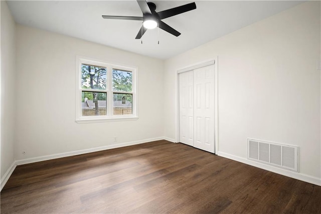 3001 Demetropolis Rd, Mobile, AL 36693 - unfurnished bedroom with baseboards, visible vents, dark wood-style floors, and a closet