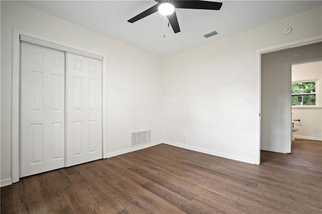 3001 Demetropolis Rd, Mobile, AL 36693 - unfurnished bedroom with baseboards, visible vents, wood finished floors, and a closet