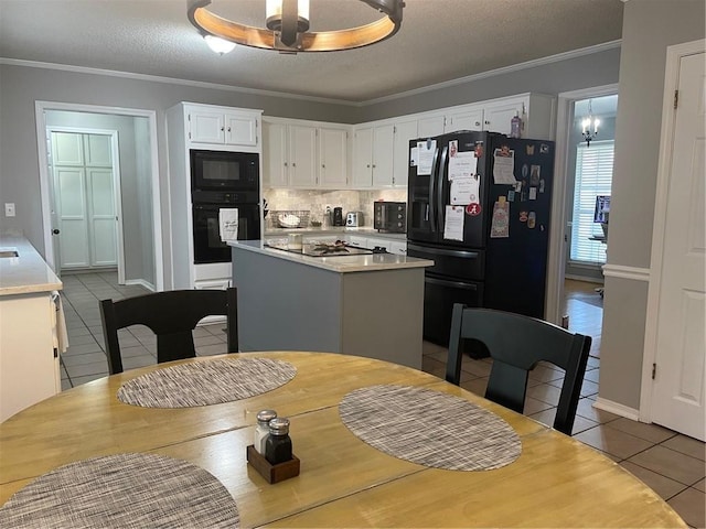 dining room with crown molding, tile patterned floors, and a textured ceiling