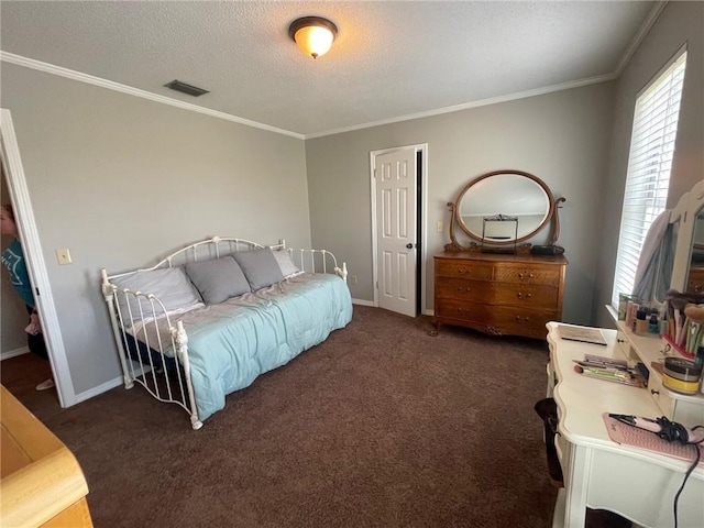 carpeted bedroom featuring visible vents, a textured ceiling, crown molding, and baseboards