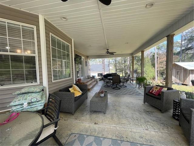 view of patio with an outdoor living space, outdoor dining area, and ceiling fan