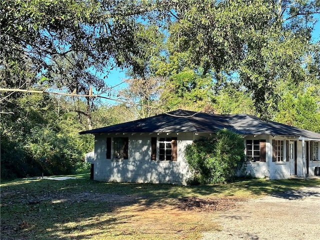 view of home's exterior with a lawn