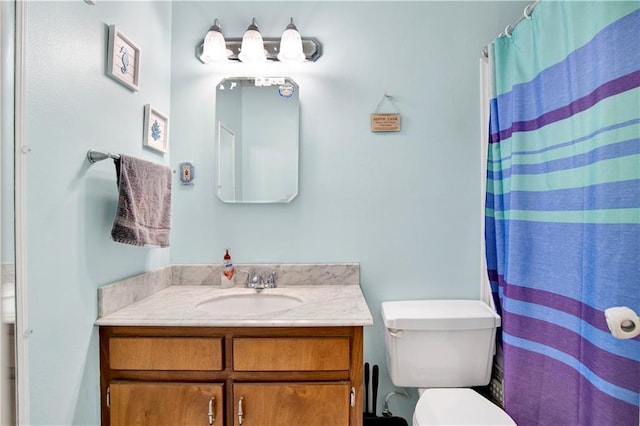 8717 Louis Poiroux Rd N, Theodore, AL 36582 - bathroom featuring vanity, toilet, and curtained shower