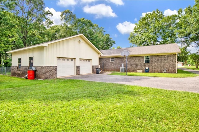 8717 Louis Poiroux Rd N, Theodore, AL 36582 - view of home's exterior featuring brick siding and a detached garage