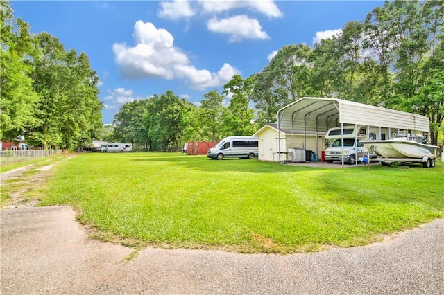 8717 Louis Poiroux Rd N, Theodore, AL 36582 - view of yard with a detached carport and view of wooded area