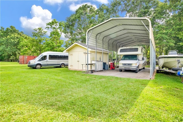 8717 Louis Poiroux Rd N, Theodore, AL 36582 - view of vehicle parking with a detached carport