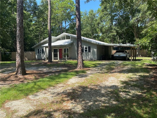 ranch-style home with a carport