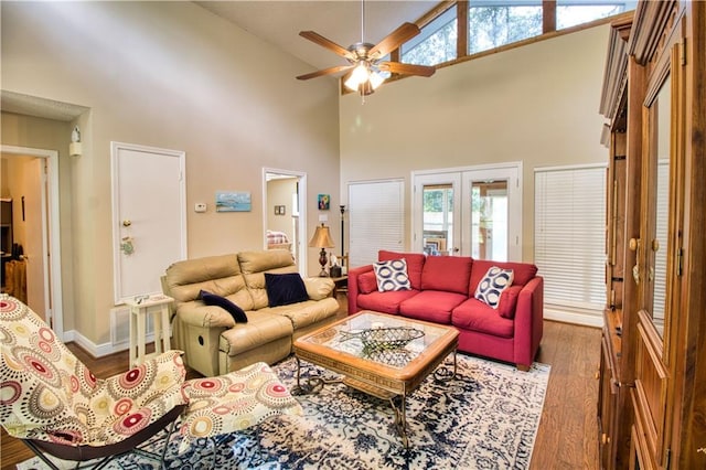 living room with french doors, hardwood / wood-style flooring, high vaulted ceiling, and ceiling fan