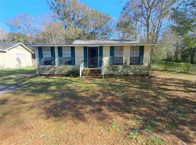 ranch-style home with a front lawn