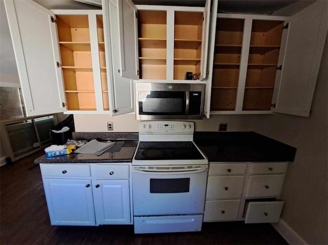 kitchen with white cabinets and white range with electric stovetop