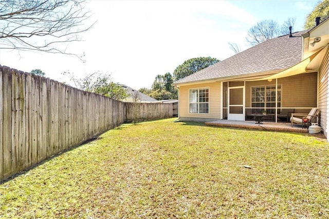 view of yard with a patio area and a fenced backyard