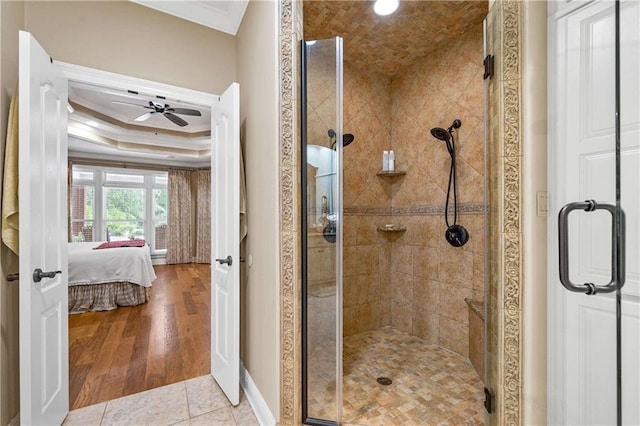 10188 Rosewood Ln, Daphne, AL 36526 - full bathroom with ornamental molding, ensuite bathroom, a shower stall, ceiling fan, and baseboards