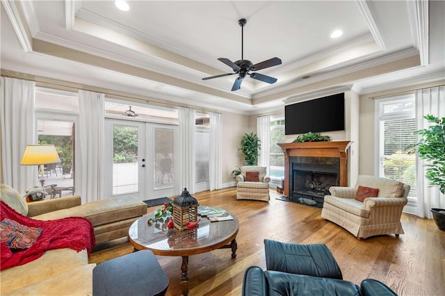 10188 Rosewood Ln, Daphne, AL 36526 - living room with plenty of natural light, a tray ceiling, ornamental molding, and ceiling fan