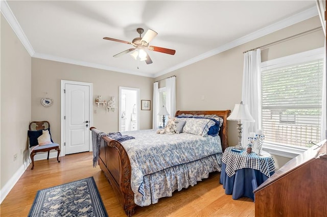 10188 Rosewood Ln, Daphne, AL 36526 - bedroom featuring multiple windows, ornamental molding, light wood finished floors, a ceiling fan, and baseboards