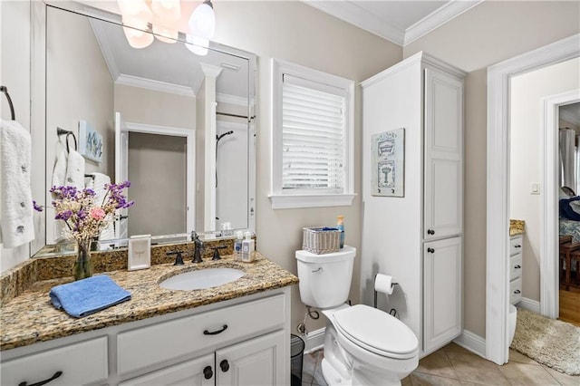 10188 Rosewood Ln, Daphne, AL 36526 - bathroom with ornamental molding, baseboards, vanity, toilet, and tile patterned floors