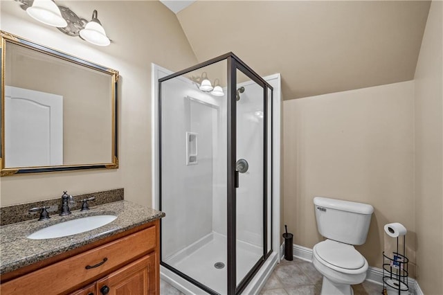 10188 Rosewood Ln, Daphne, AL 36526 - bathroom featuring a shower stall, toilet, vanity, vaulted ceiling, and tile patterned floors