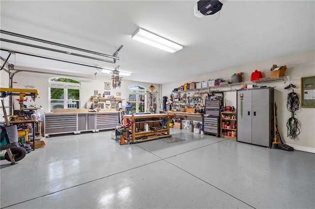 10188 Rosewood Ln, Daphne, AL 36526 - garage featuring a workshop area and a garage door opener