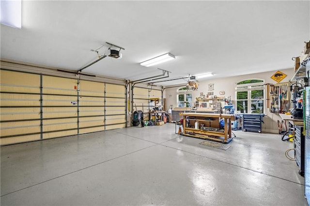 10188 Rosewood Ln, Daphne, AL 36526 - garage with a workshop area and a garage door opener