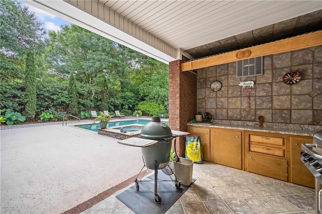 10188 Rosewood Ln, Daphne, AL 36526 - view of patio featuring exterior kitchen and a pool with connected hot tub