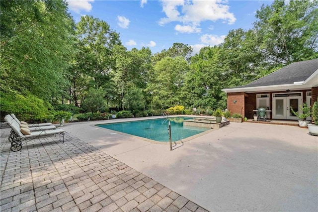10188 Rosewood Ln, Daphne, AL 36526 - outdoor pool featuring a patio, french doors, and an in-ground hot tub