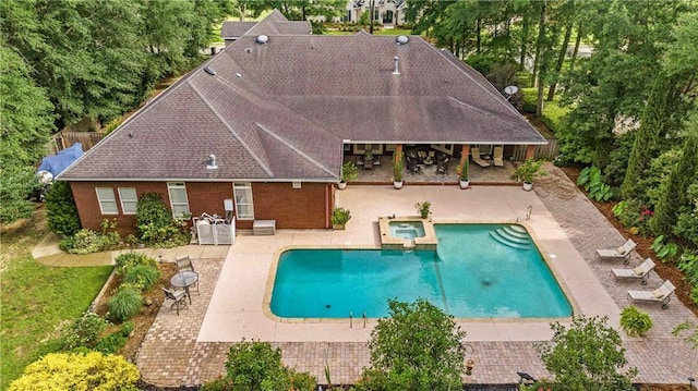 10188 Rosewood Ln, Daphne, AL 36526 - view of swimming pool with a patio, a pool with connected hot tub, and view of wooded area