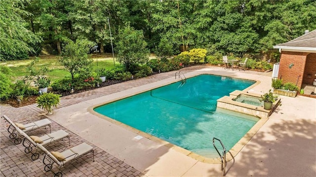 10188 Rosewood Ln, Daphne, AL 36526 - view of swimming pool featuring a patio and a pool with connected hot tub