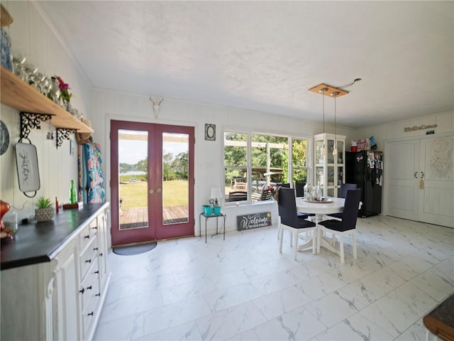 unfurnished dining area with french doors