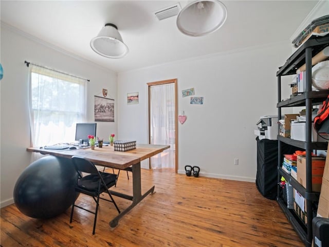 office area with ornamental molding and hardwood / wood-style flooring