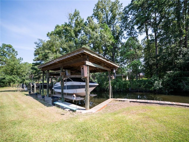 dock area with a yard and a water view