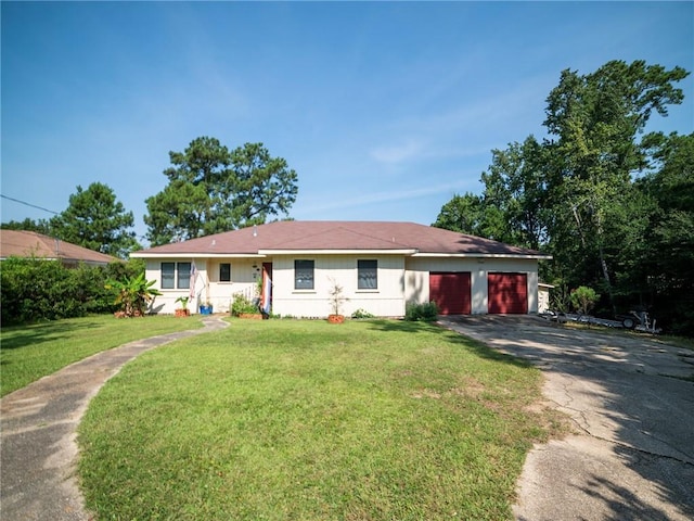 ranch-style home with a front lawn and a garage