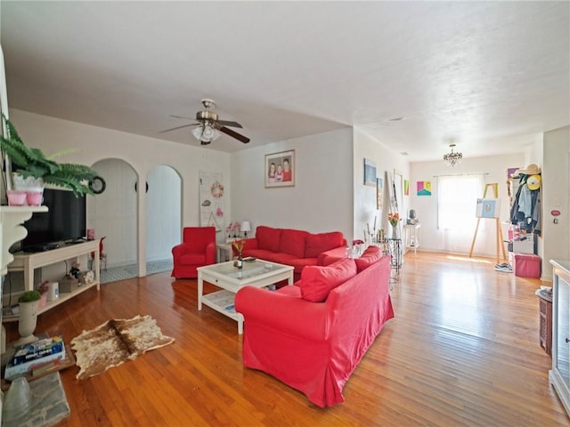 living room featuring hardwood / wood-style flooring and ceiling fan