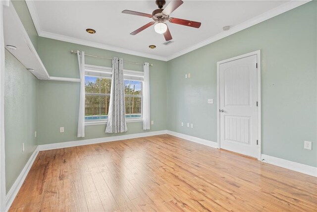 empty room with ceiling fan and light carpet