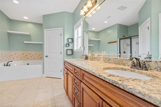 bathroom with tile patterned floors, independent shower and bath, and vanity