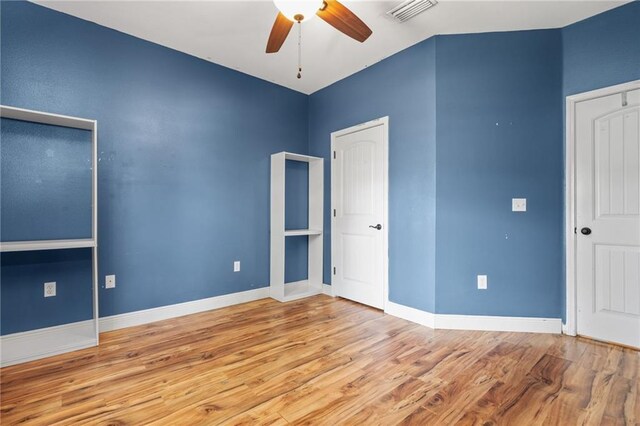 unfurnished living room featuring ceiling fan, lofted ceiling, and carpet flooring