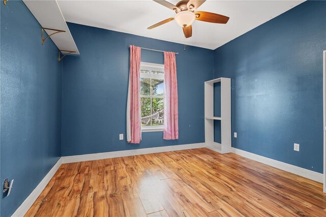 carpeted empty room featuring vaulted ceiling and ceiling fan