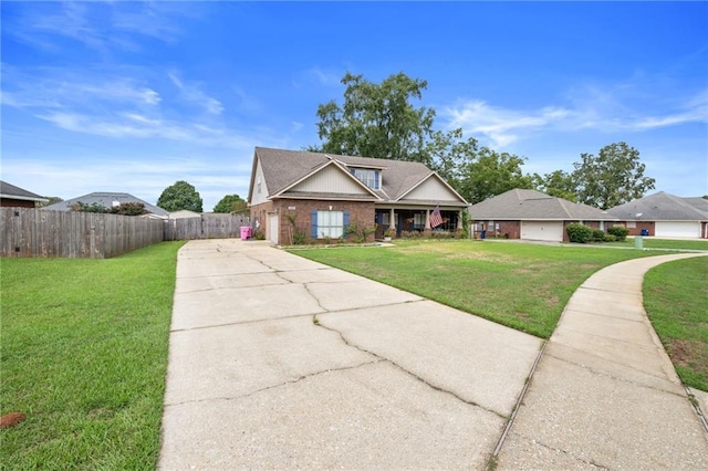 view of front of home featuring a garage and a front yard