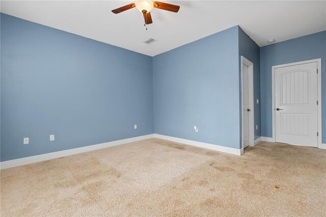 unfurnished room with light wood-type flooring and ceiling fan