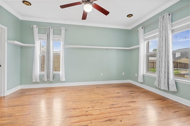 unfurnished room with ornamental molding, wood-type flooring, and ceiling fan