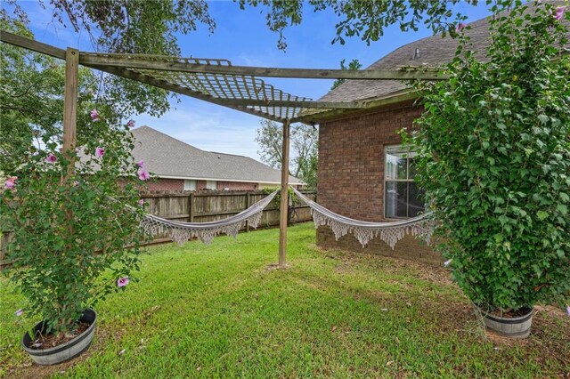 view of pool with a patio and a lawn