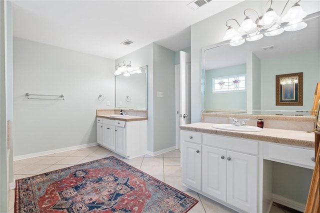 bathroom with tile patterned flooring and vanity