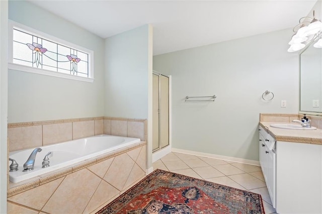 bathroom featuring vanity, independent shower and bath, and tile patterned flooring