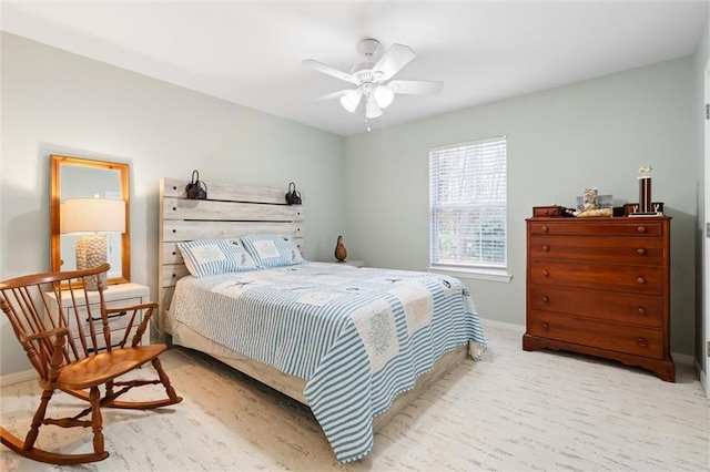 bedroom with light colored carpet and ceiling fan