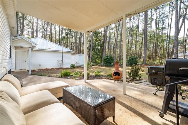 view of patio featuring a storage unit