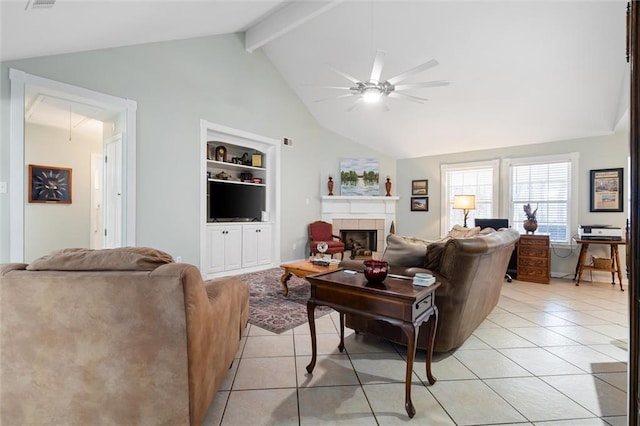 living room with light tile patterned flooring, ceiling fan, a tile fireplace, and built in features