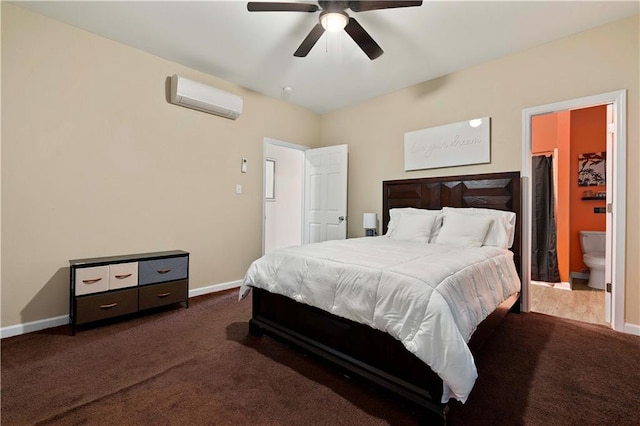 carpeted bedroom with a wall mounted AC, ceiling fan, a closet, a walk in closet, and ensuite bathroom