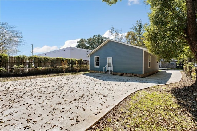 view of side of home with a patio