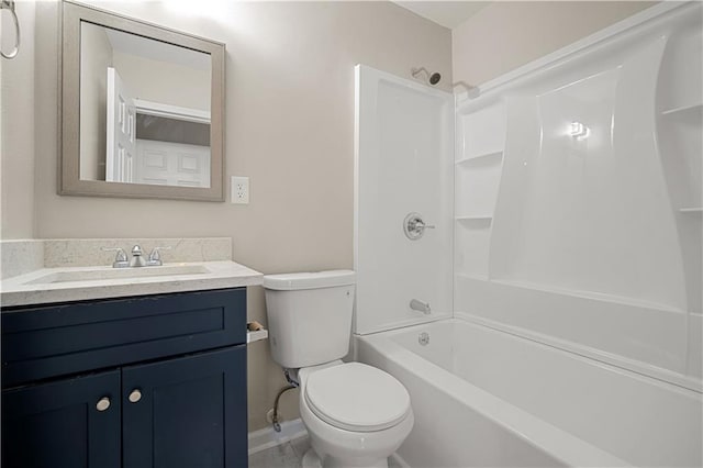 full bath featuring toilet, baseboards, tub / shower combination, and vanity