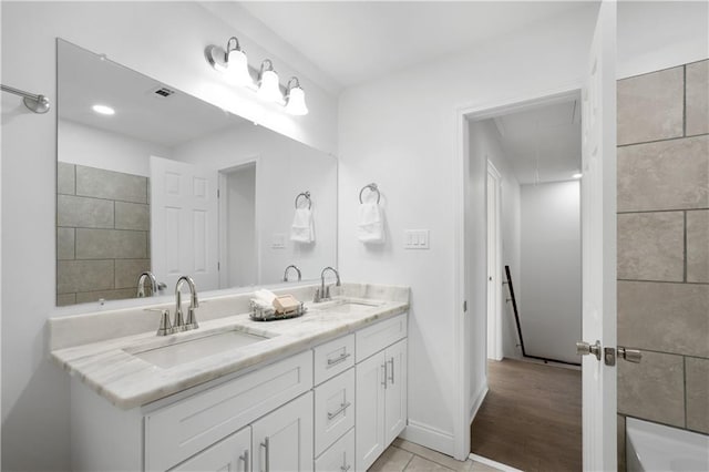 bathroom with vanity and tile patterned floors