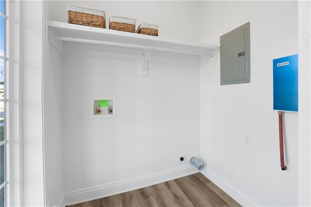 laundry room featuring hookup for a washing machine, electric panel, and hardwood / wood-style floors